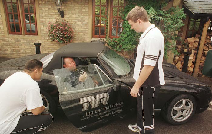 UNITED KINGDOM - OCTOBER 09: All Blacks Carl Hoeft and Andrew Mehrtens with Phil KingsleyJones, Jonah Lomu's manager look over Lomu's TVR sports car parked at the Pennyhill Country Club, Bagshot, Friday, base for the teams Rugby World Cup camp. (Photo by Ross Setford/Getty Images)