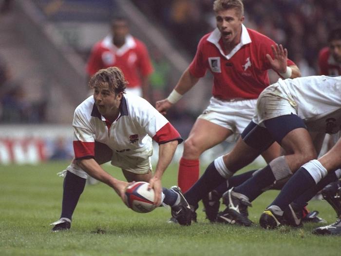 30 Nov 1996: Andy Gomarsall of England passes out from the scrum during the Save and Prosper international between England and the New Zealand Barbarians at Twickenham in Middlesex. New Zealand won by 19-34. Mandatory Credit: David Rogers/Allsport