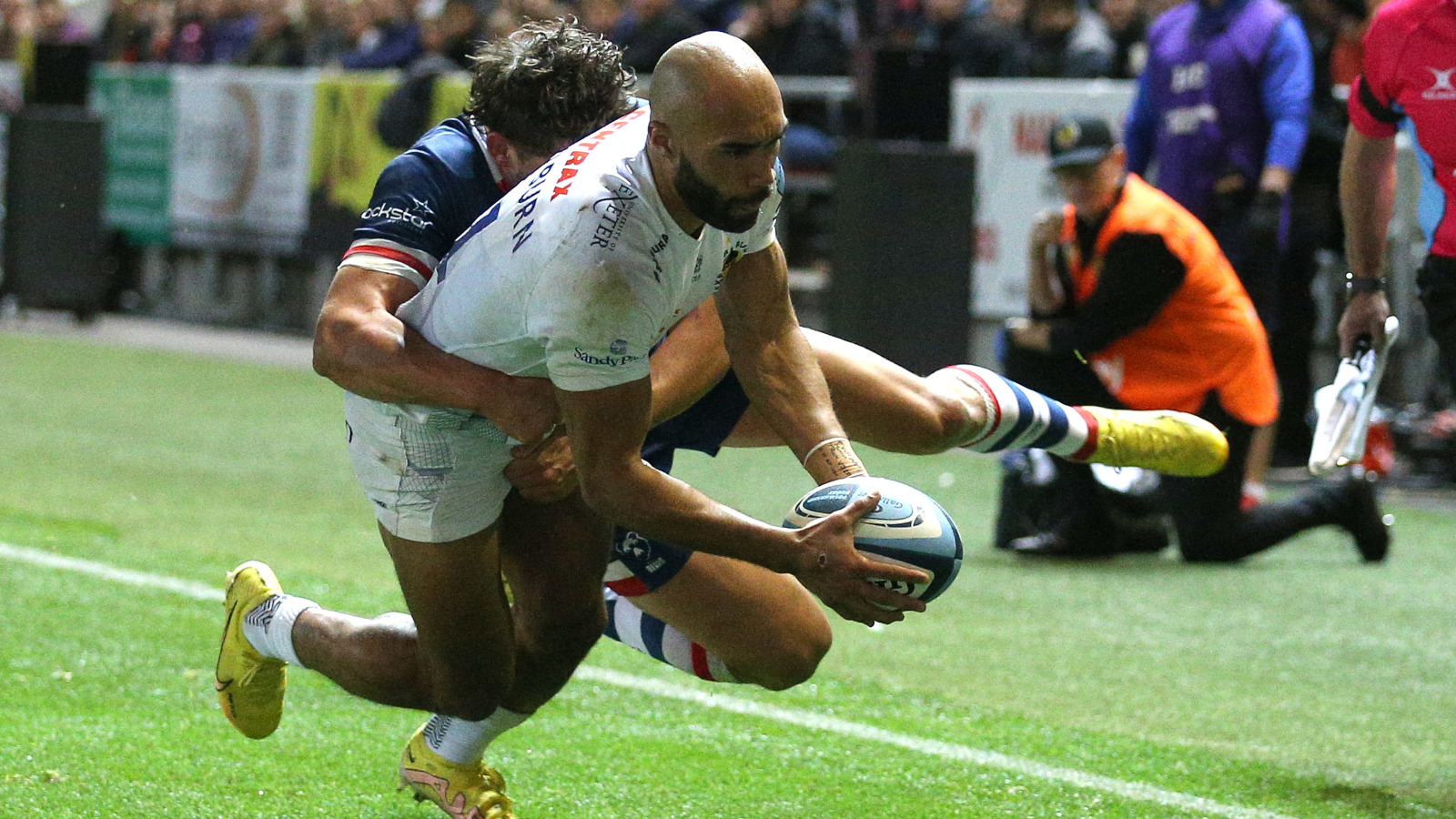 Exeter's Olly Woodburn scores in the corner against Bristol in the Premiership.