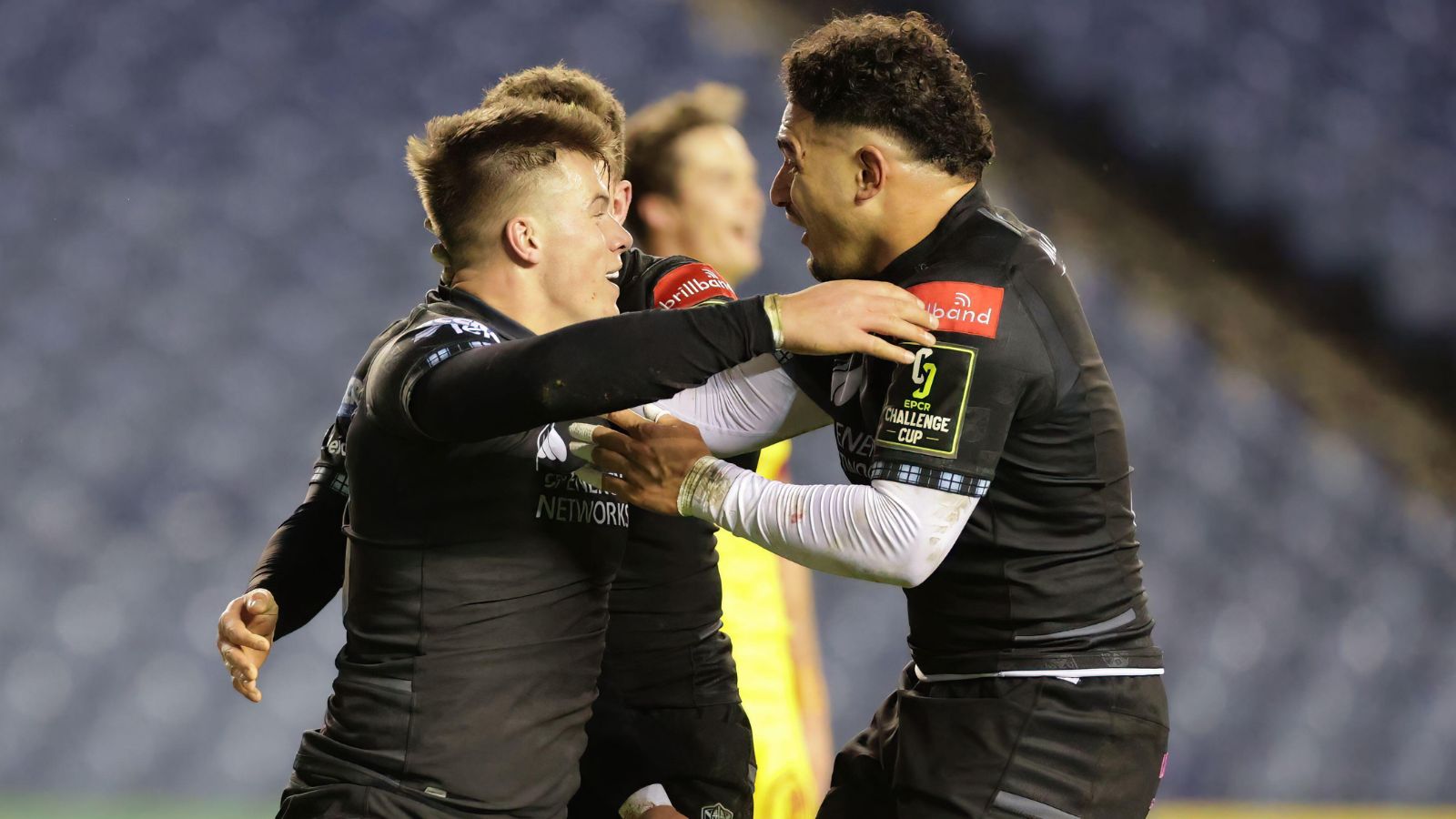 Glasgow Warriors' Hue Jones celebrates with Sione Tuipulotu after scoring their second try during the EPCR Challenge Cup match at BT Murrayfield Stadium, Edinburgh. Picture date: Friday December 16, 2022