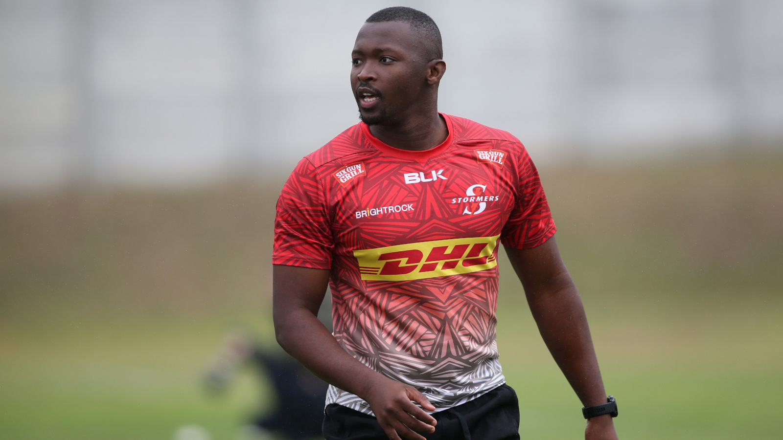 Stormers star Junior Pokomela looks on.