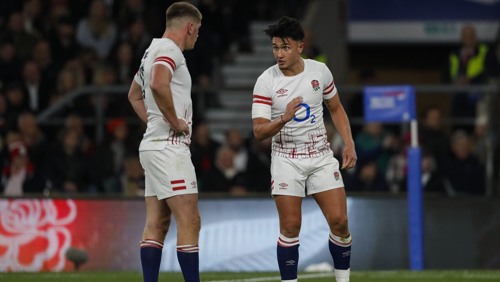 England's Owen Farrell and Marcus Smith talk during a game.