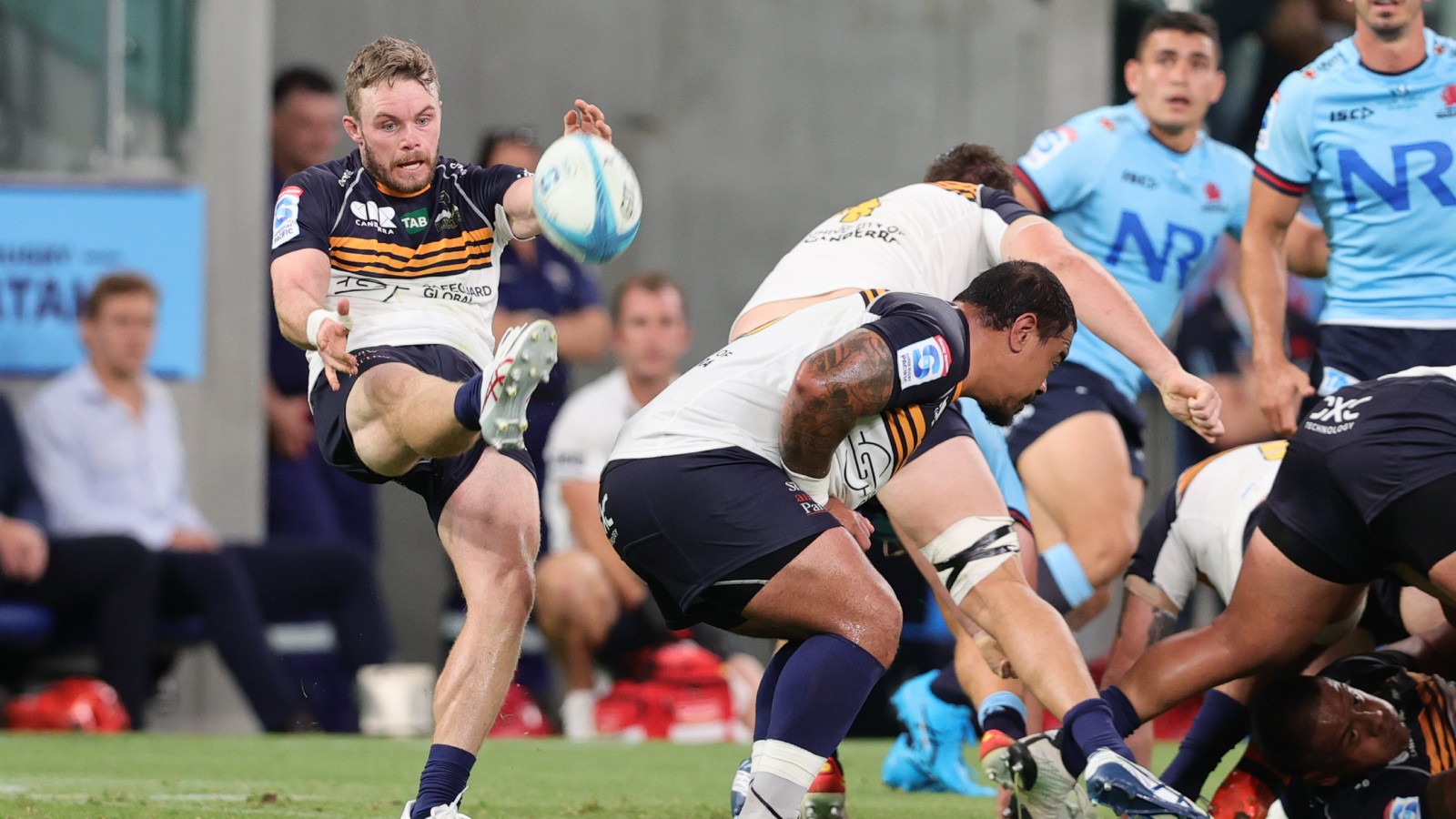 Australia: Ryan Lonergan kicks the ball for the Brumbies.