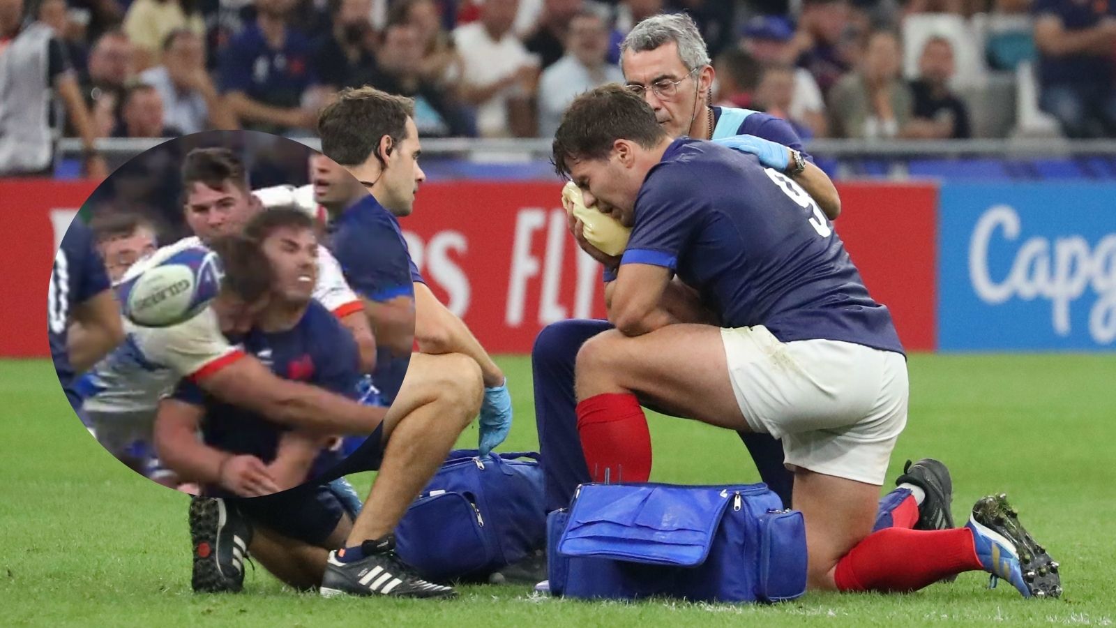 France captain Antoine Dupont holds his face after a high tackle in the Rugby World Cup game against Namibia.