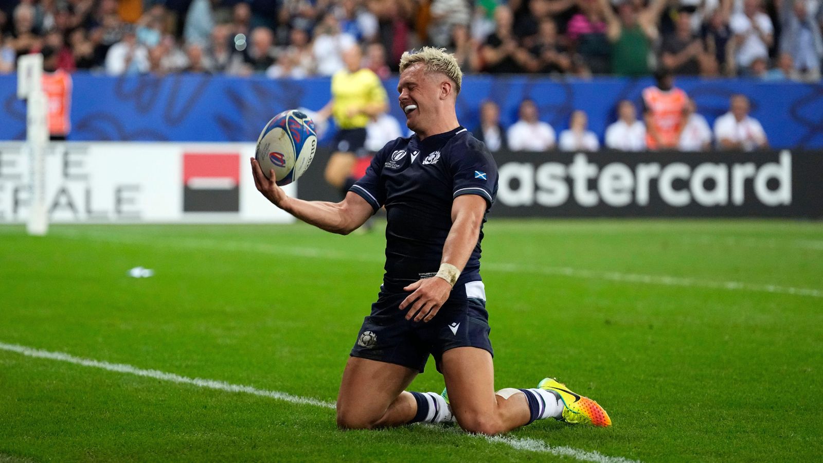 Scotland's Darcy Graham celebrates after scoring a try during the Rugby World Cup Pool B match between Scotland and Tonga at the Stade de Nice