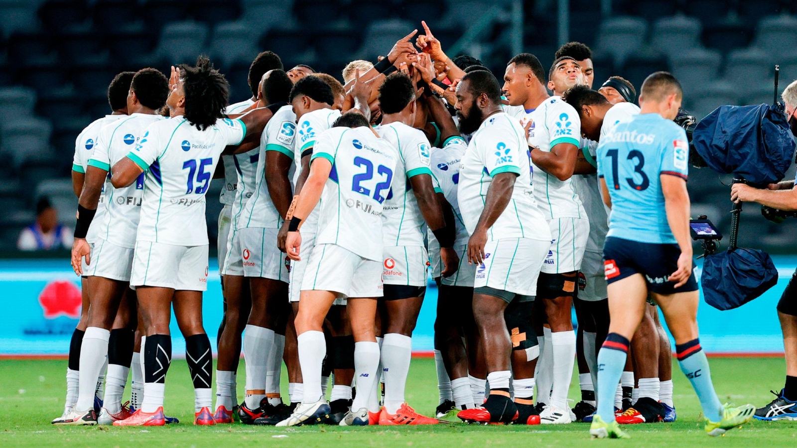 Fijian Drua huddle during a Super Rugby Pacific game.