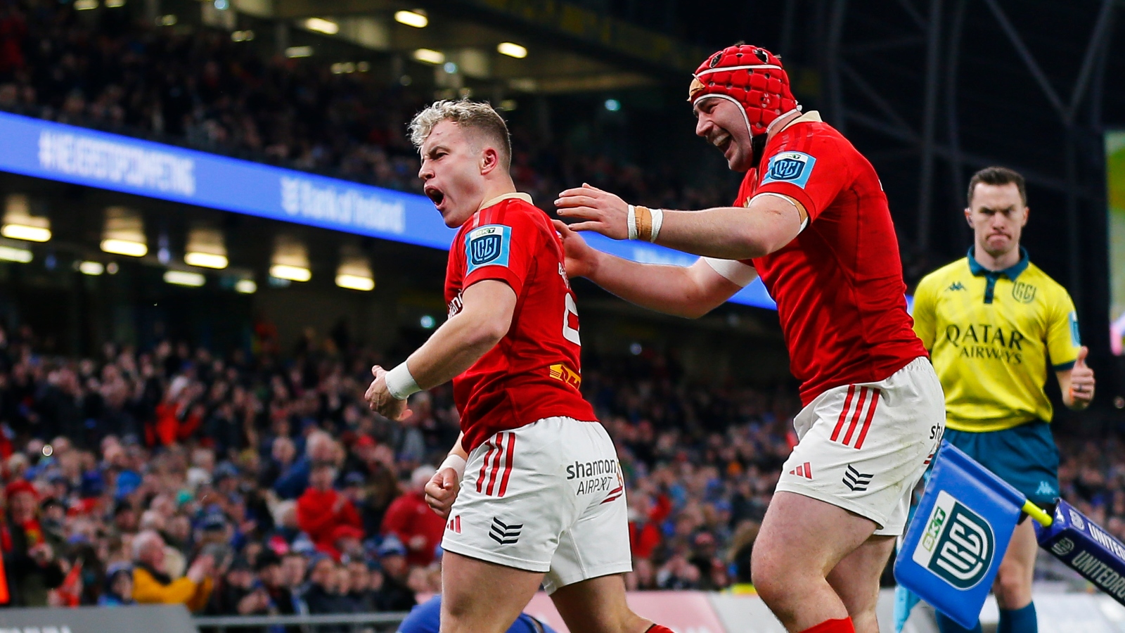 Munster stars celebrate a try.
