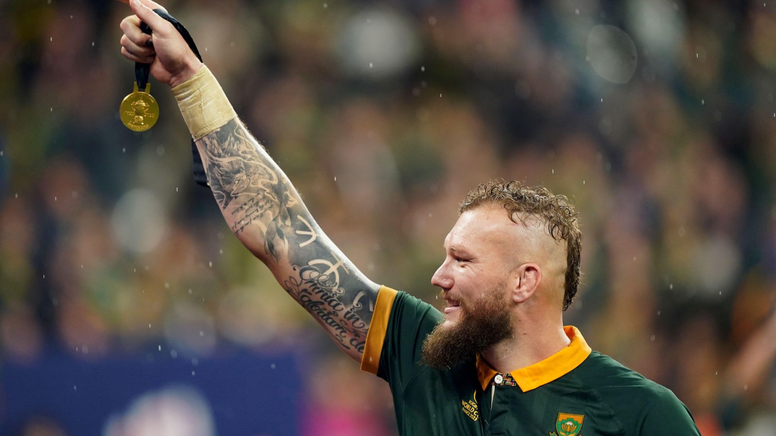 South Africa's RG Snyman holds aloft his medal following victory over New Zealand in the Rugby World Cup 2023 final at the Stade de France in Paris, France.