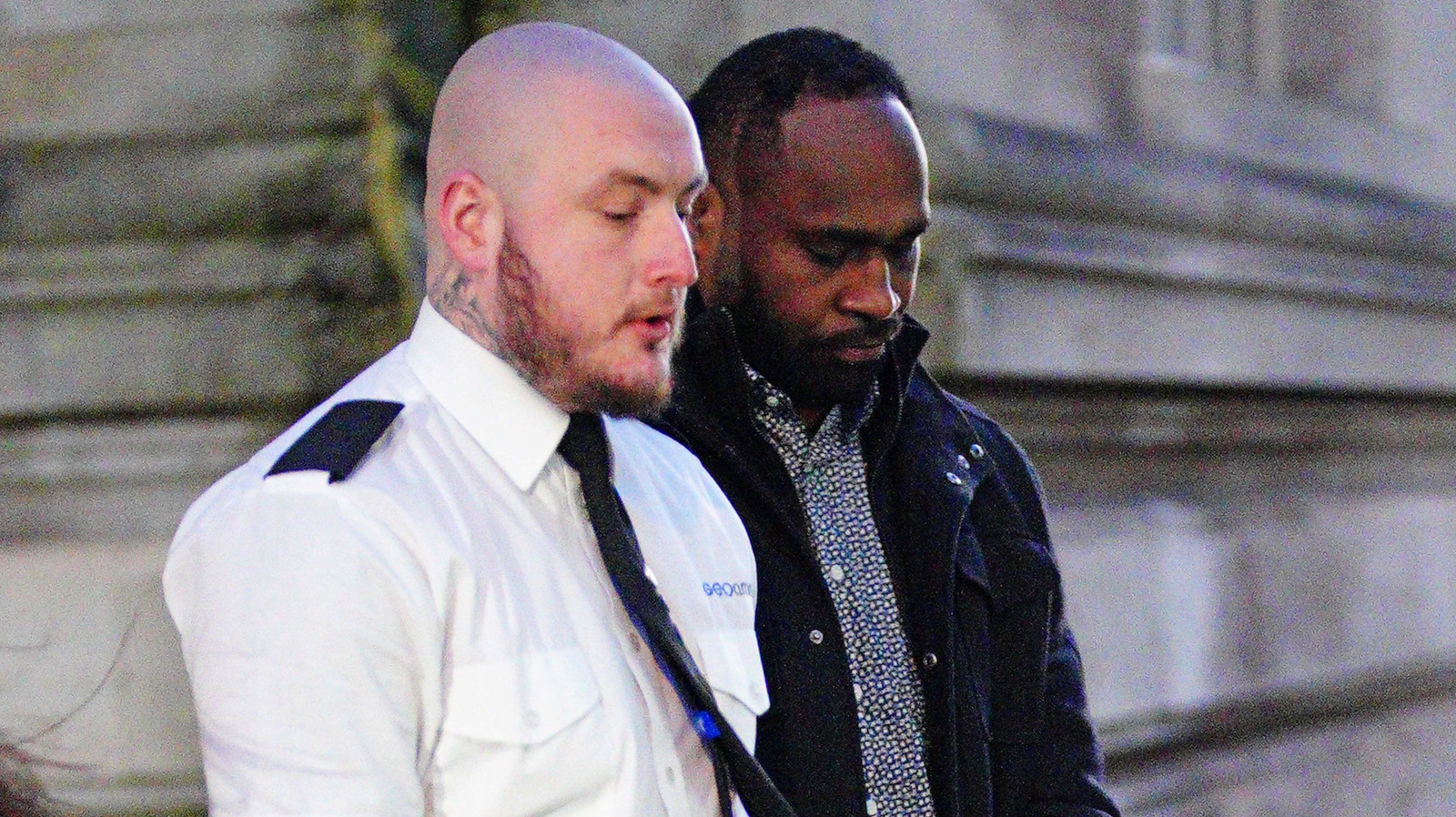 Fiji international Api Ratuniyarawa is led out of Cardiff Crown Court.
