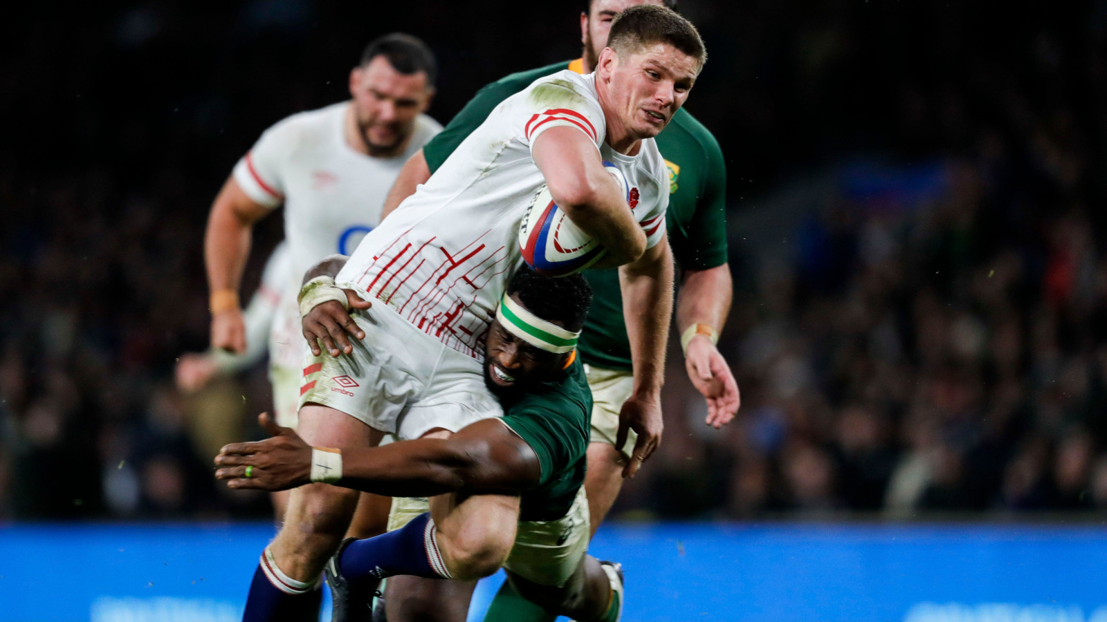 England's Owen Farrell being tackled by South Africa Siya Kolisi.