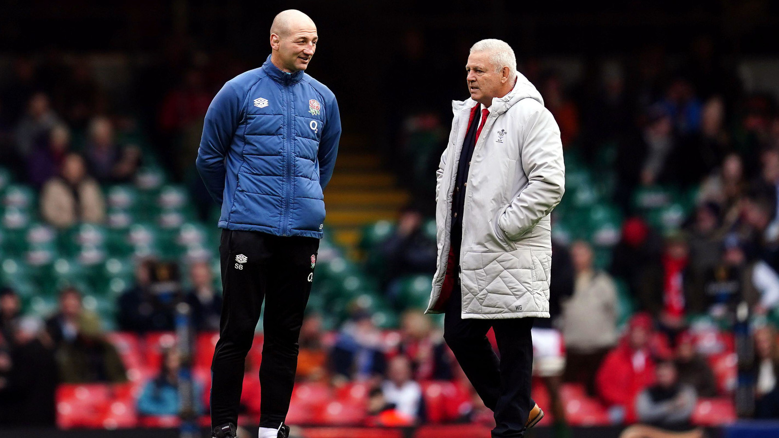 Wales head coach Warren Gatland speaking with England boss Steve Borthwick.