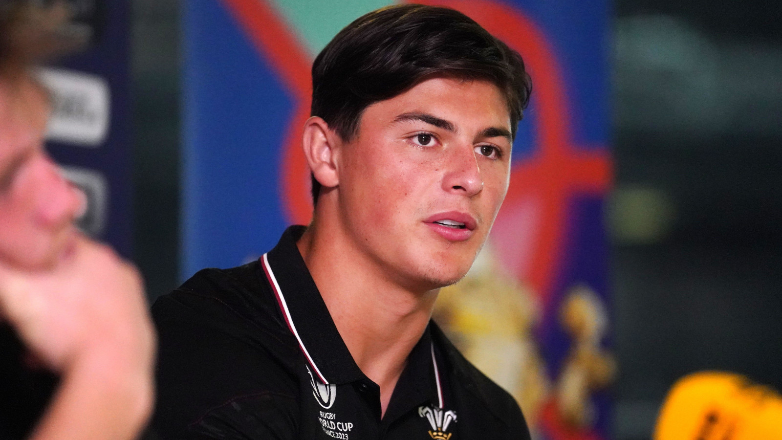 Louis Rees-Zammit in a press conference during Wales' Rugby World Cup campaign.