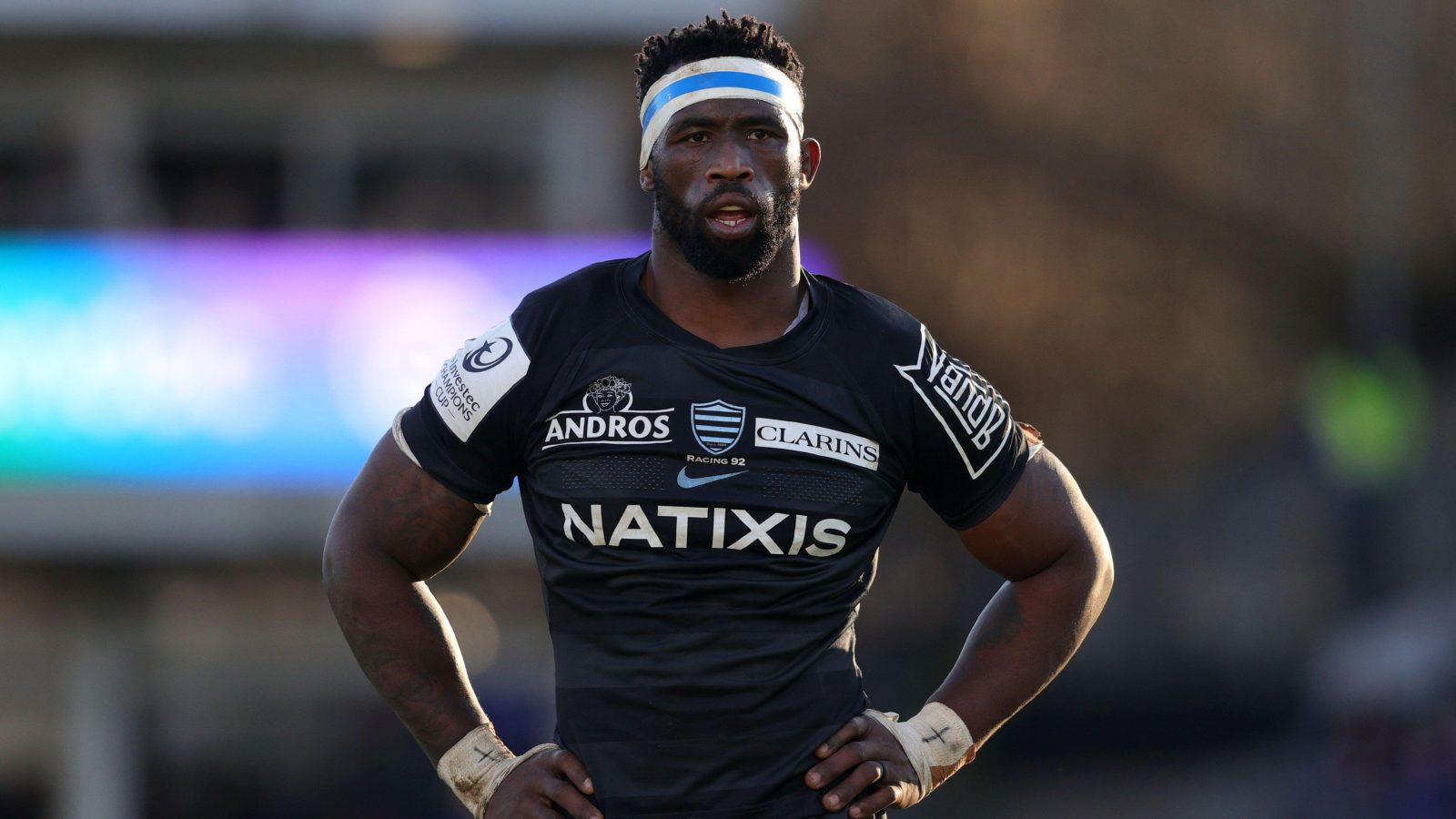 Racing 92 star Siya Kolisi looks on.