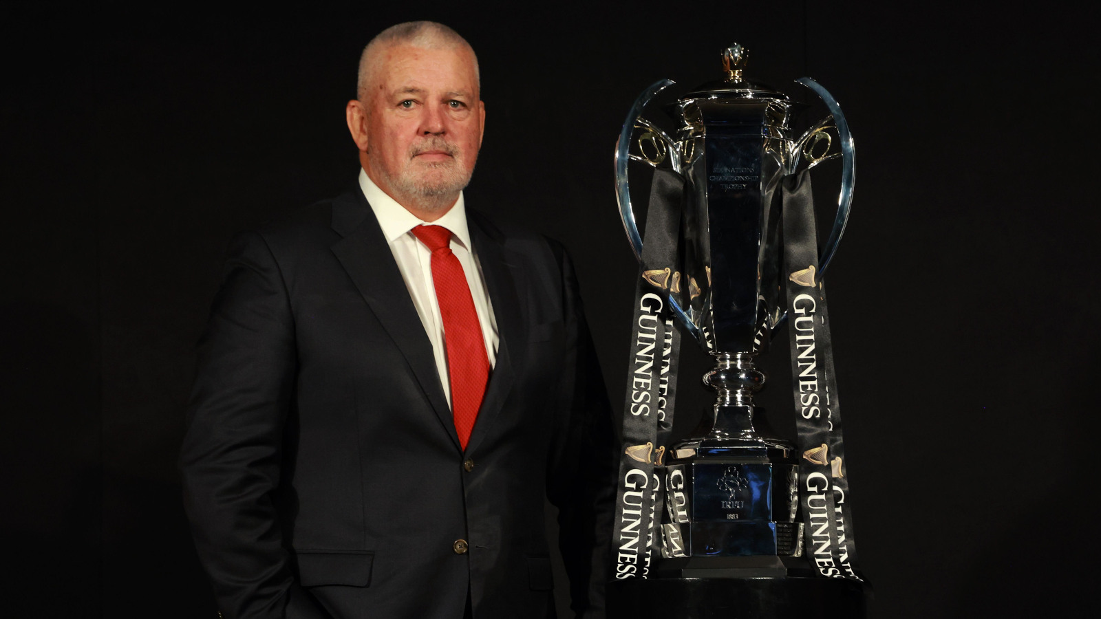 Wales head coach Warren Gatland alongside Six Nations trophy.