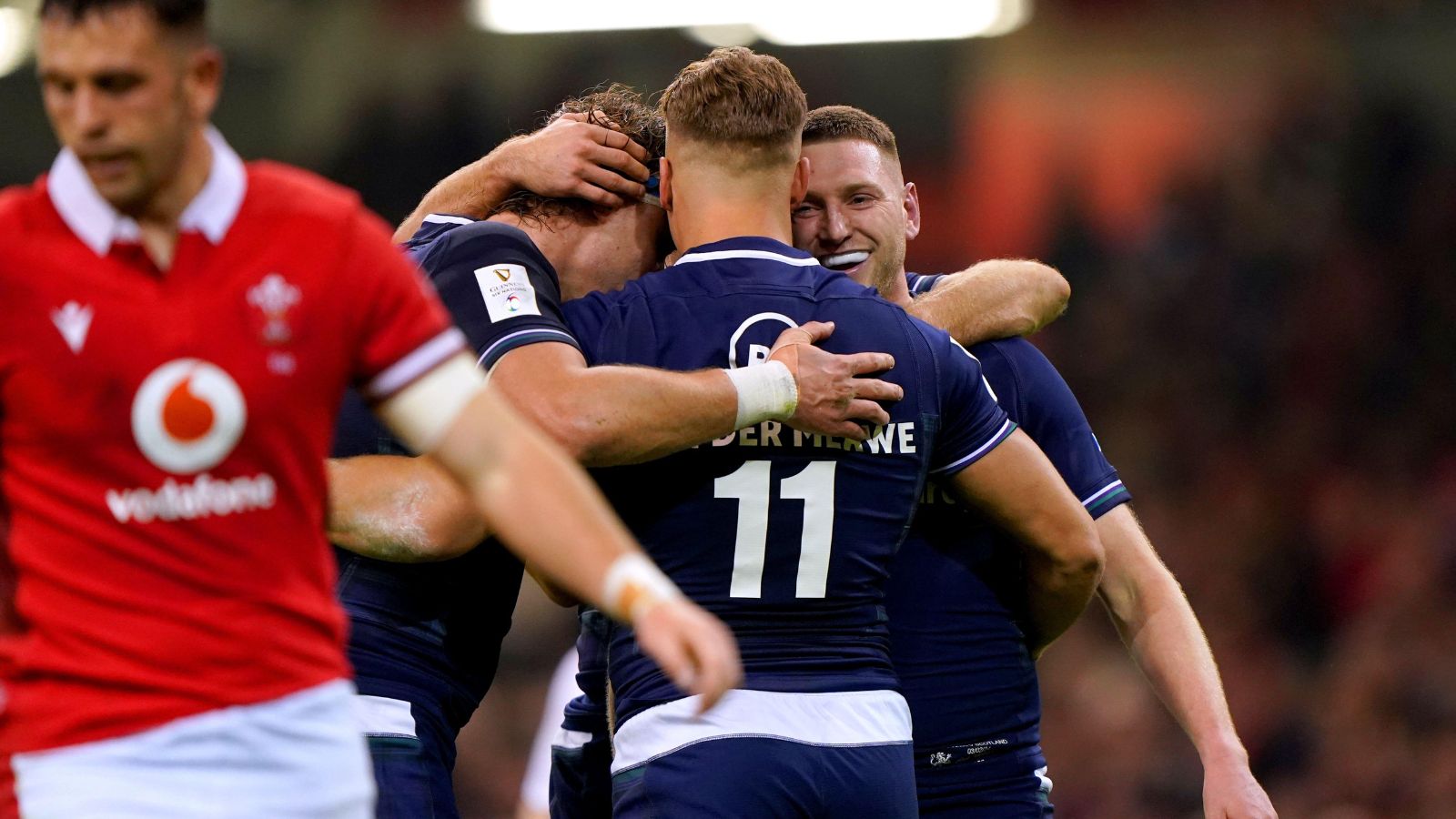 Scotland's Duhan van der Merwe (centre) celebrates with team-mates Finn Russell and Jamie Ritchie after scoring their side's second try of the game during the Guinness Six Nations match at the Principality Stadium, Cardiff.
