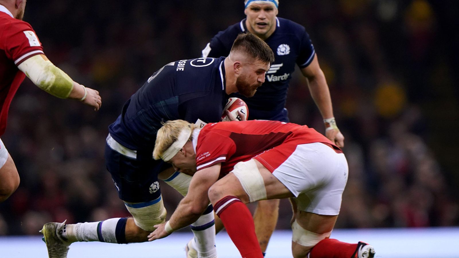 Scotland's Luke Crosbie is tackled by Wales' Aaron Wainwright during the Guinness Six Nations match at the Principality Stadium, Cardiff.
