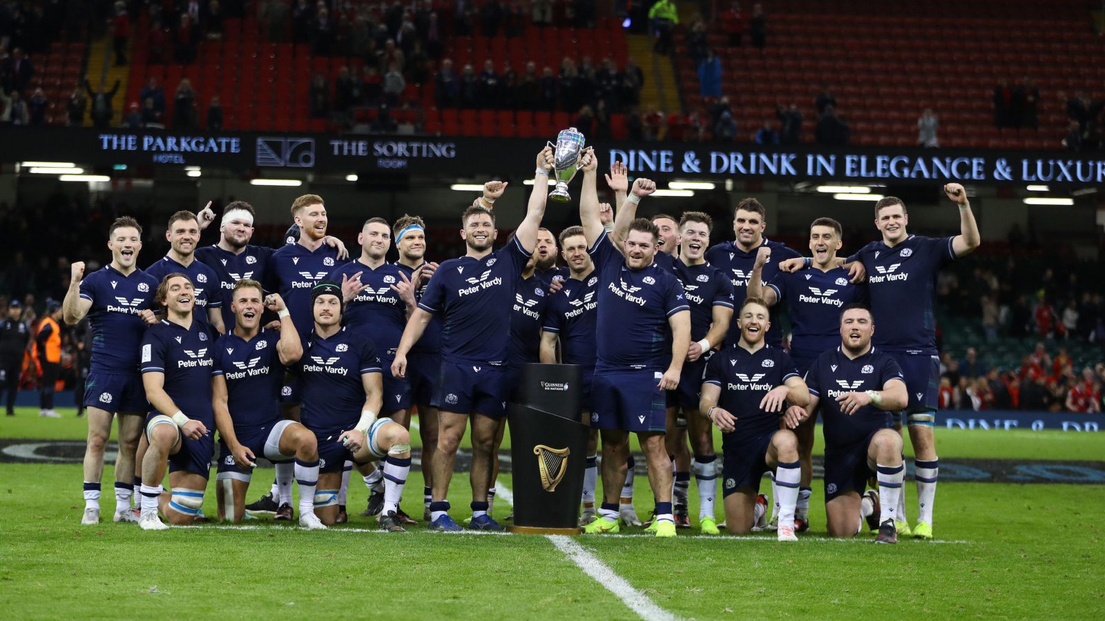 Scotland squad celebrates with the Doddie Weir Cup.