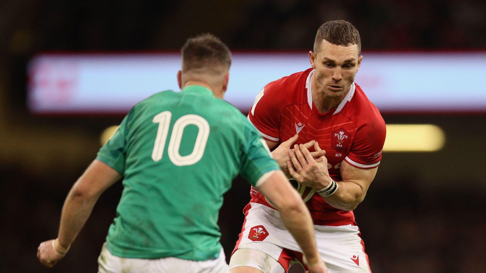 Wales' George North and Ireland's Jonathan Sexton during the Guinness Six Nations match at the Principality Stadium, Cardiff.
