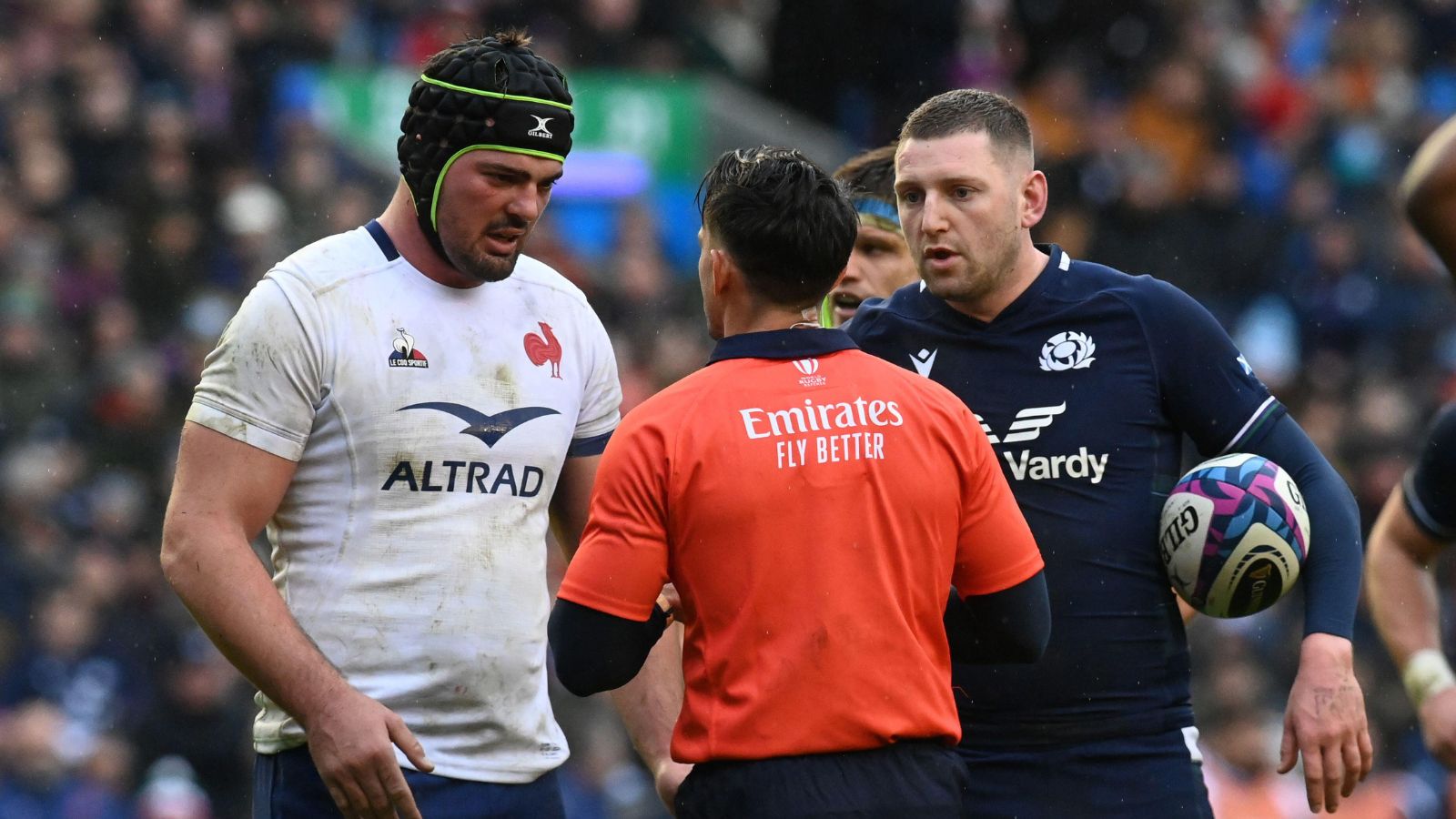 Six Nations match Scotland vs France.Referee Nic Berry (RA) exchanges word with captains Gregory Alldritt of France & Finn Russell of Scotland
