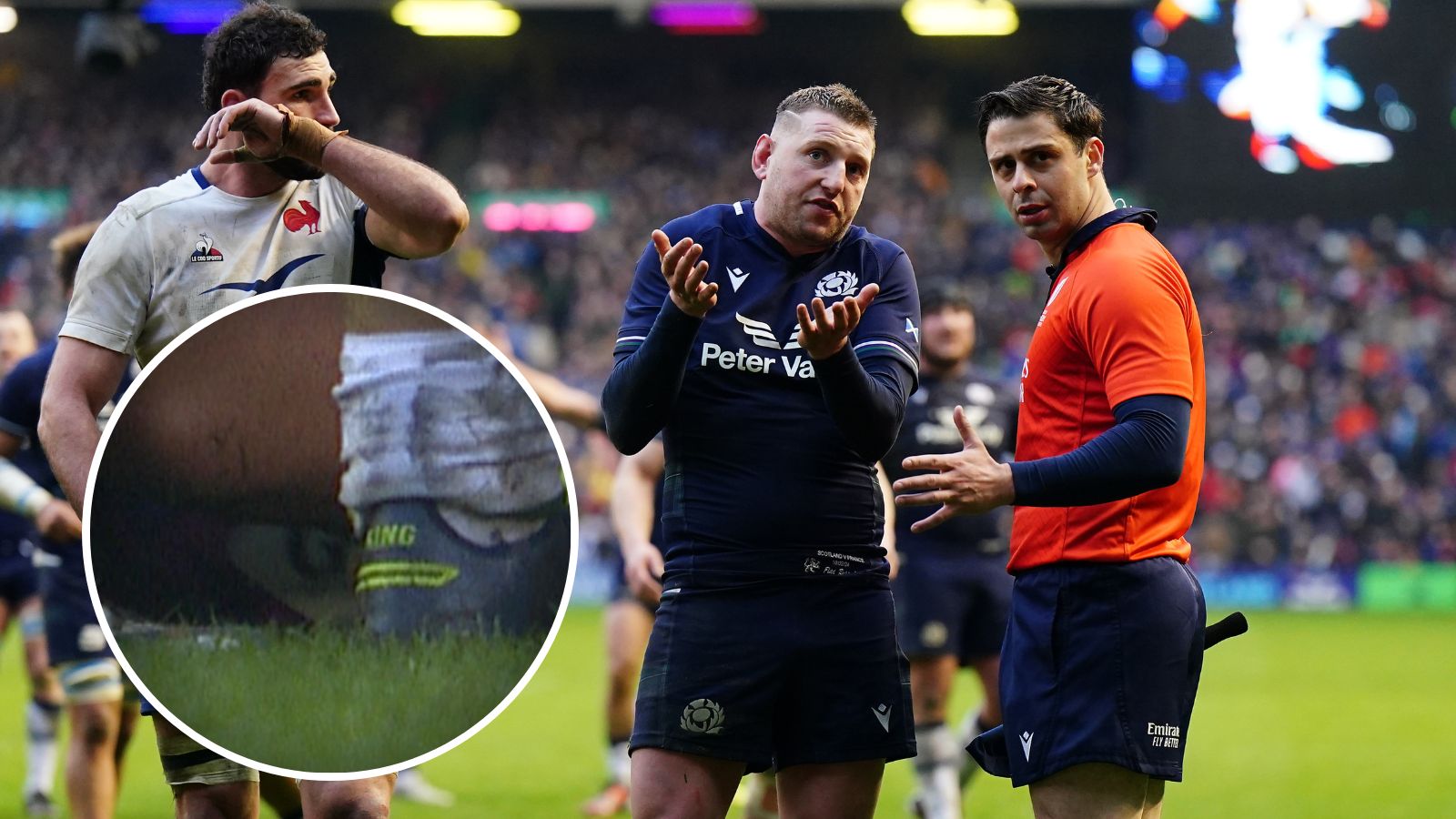 Scotland's Finn Russell speaks to referee Nika Amashukeli as they wait for a TMO decision on a Scotland try late in the Guinness Six Nations match at the Scottish Gas Murrayfield Stadium, Edinburgh.