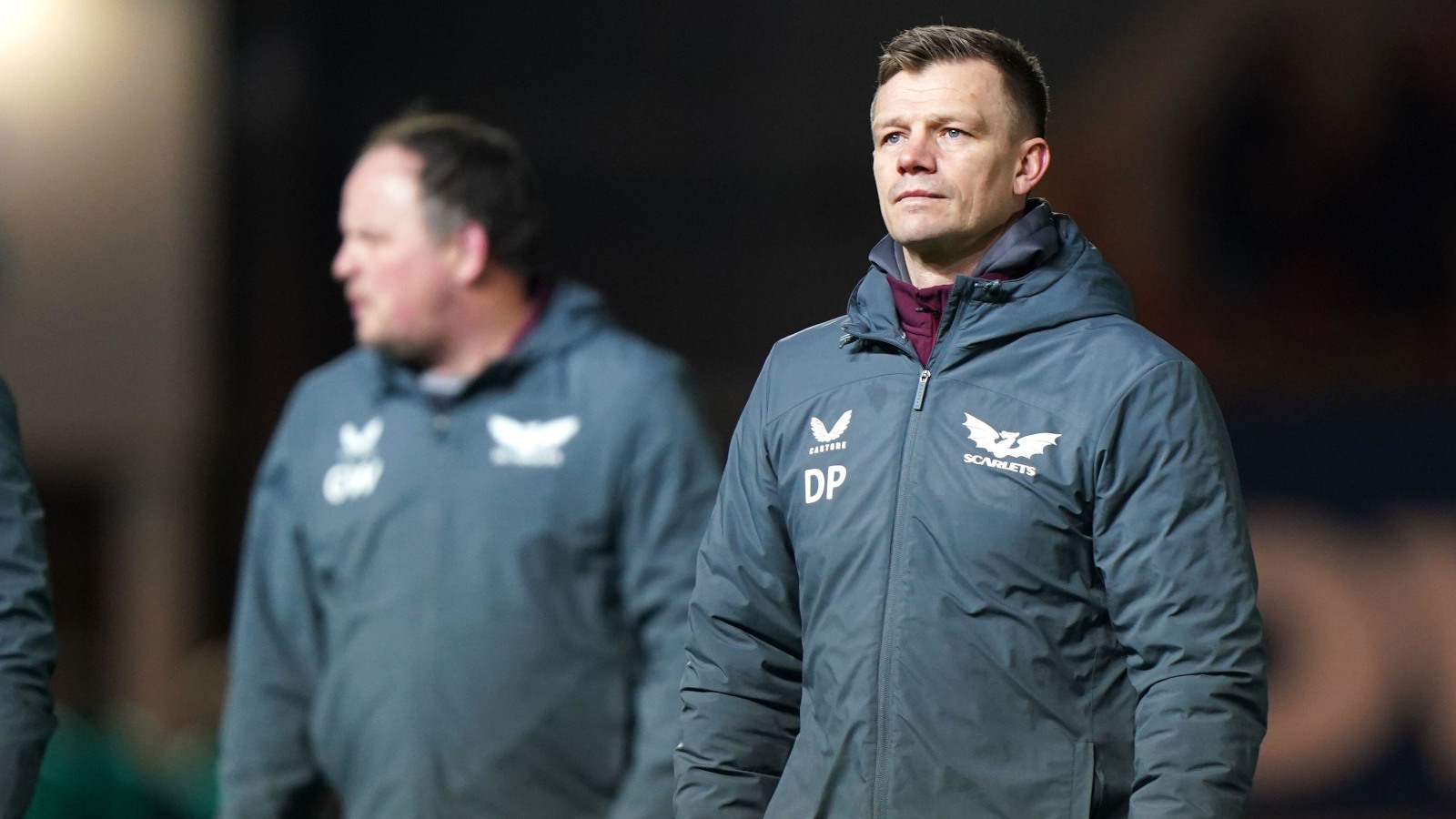 Gareth Williams in background and Scarlets boss Dwayne Peel.