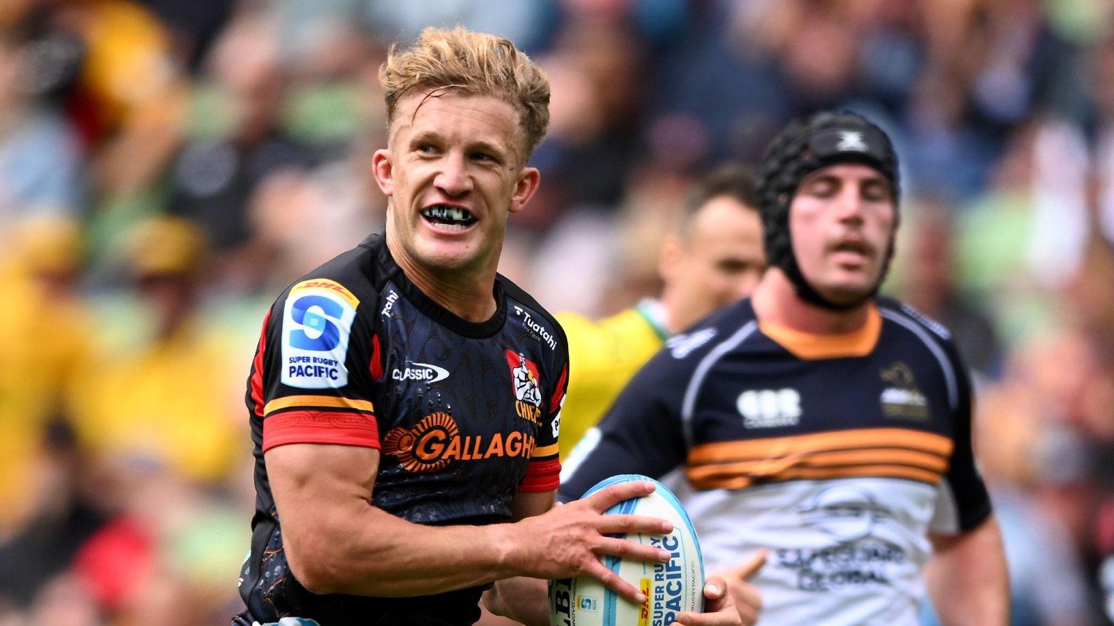 Damian McKenzie on the charge for the Chiefs against the Brumbies.