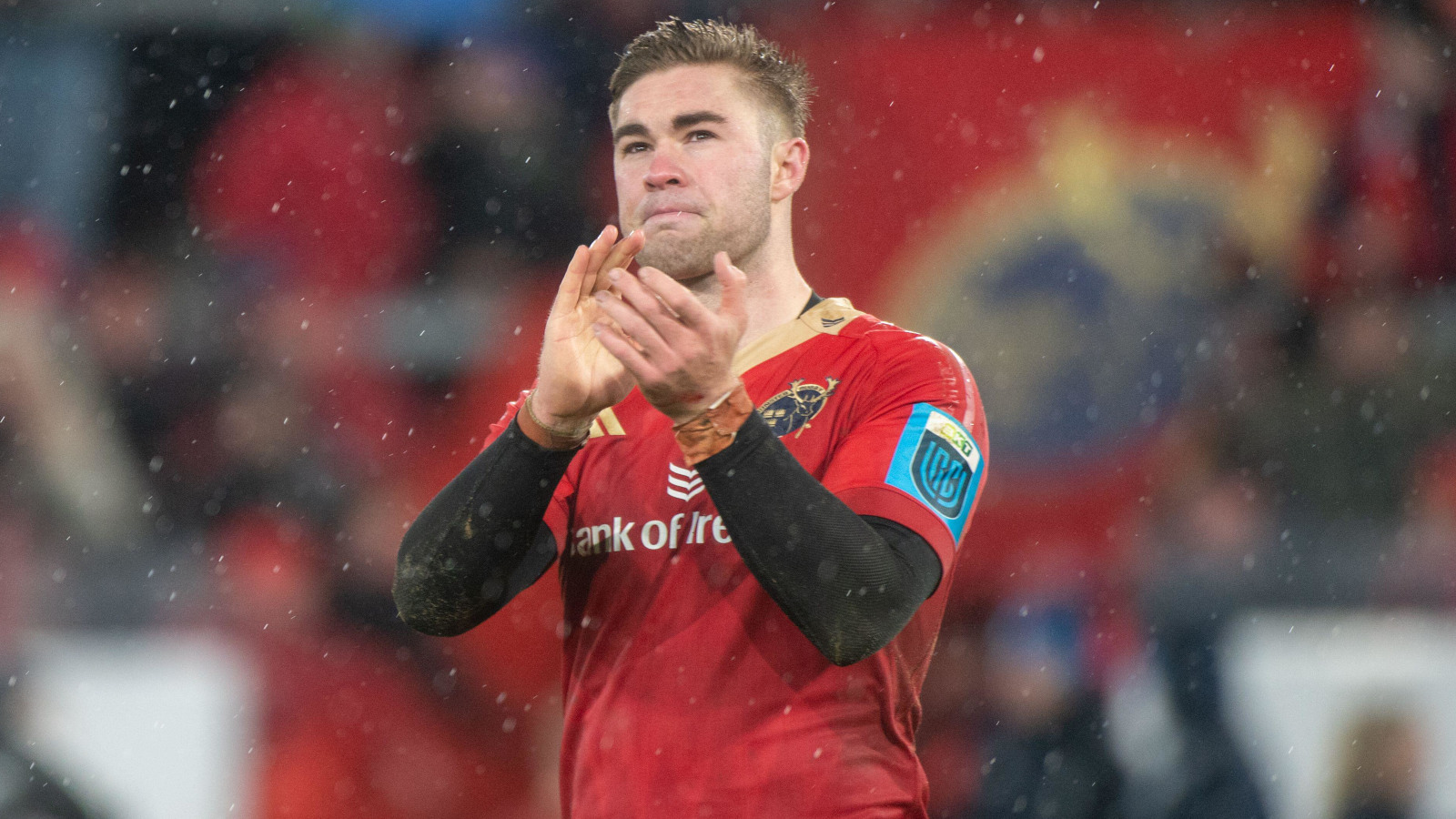 Munster fly-half Jack Crowley clapping fans.