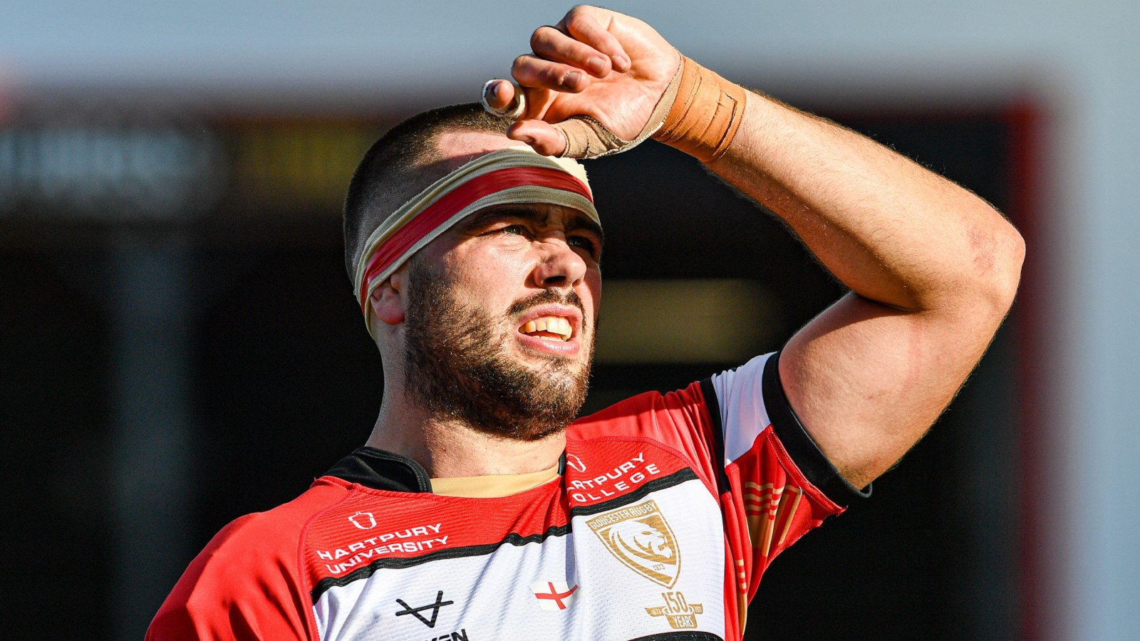Gloucester skipper Lewis Ludlow looks on.
