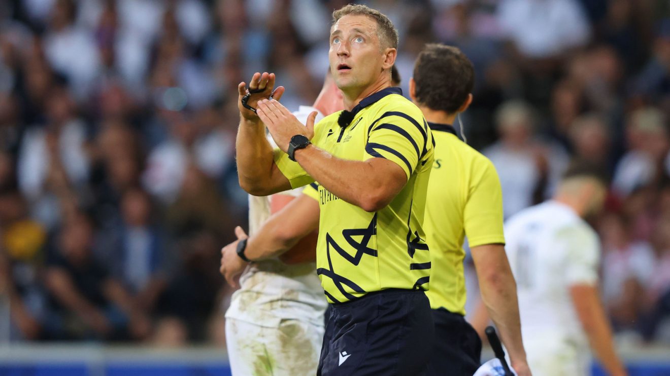 Referee Andrew Brace going to TMO Brian MacNeice during Rugby World Cup clash between England and Samoa.