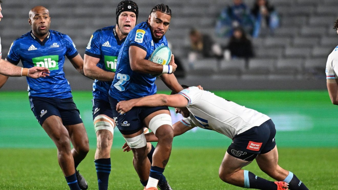 Blues star Hoskins Sotutu with ball in hand.
