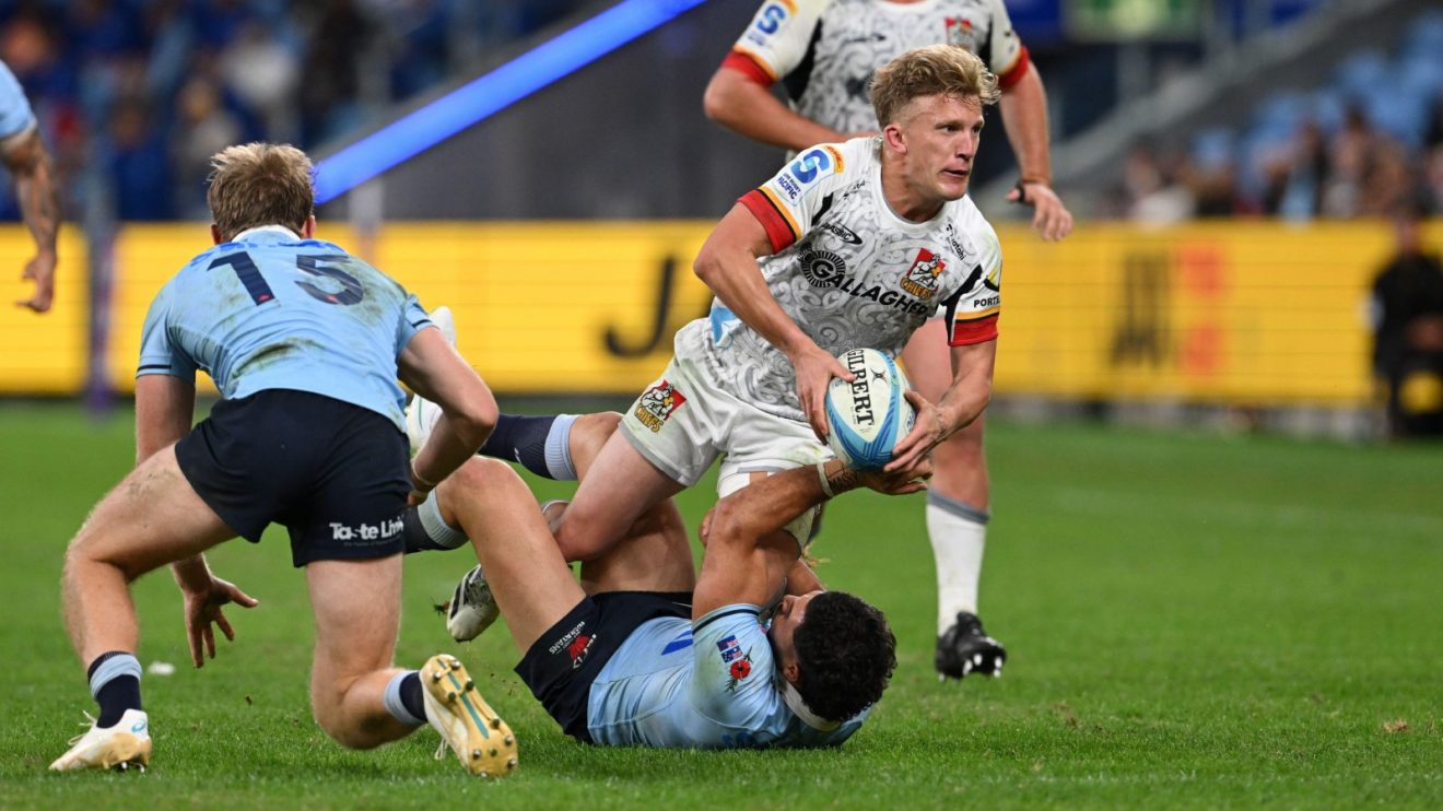 Chiefs star Damian McKenzie passing the ball.