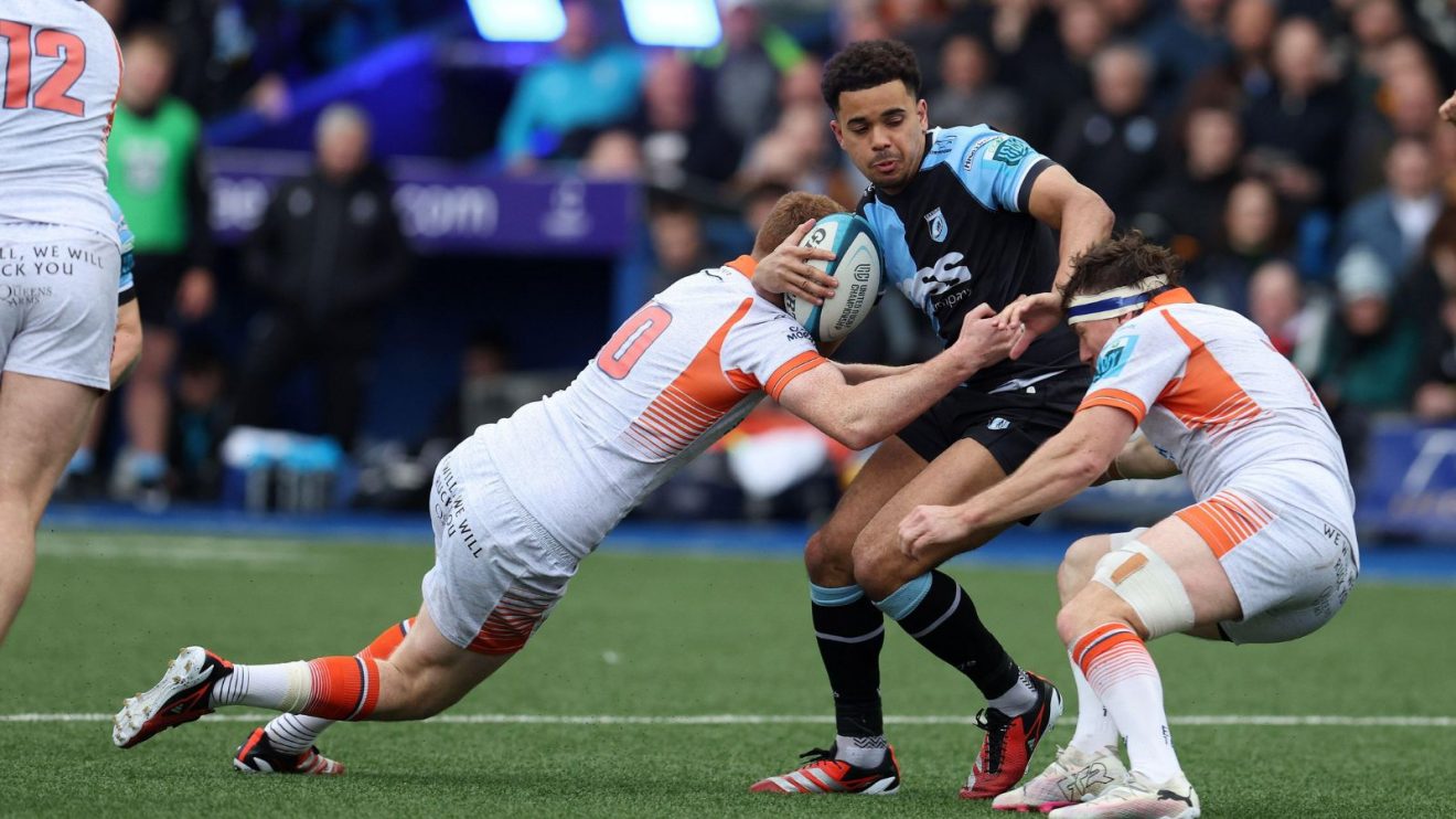 Ben Thomas of Cardiff rugby is tackled.