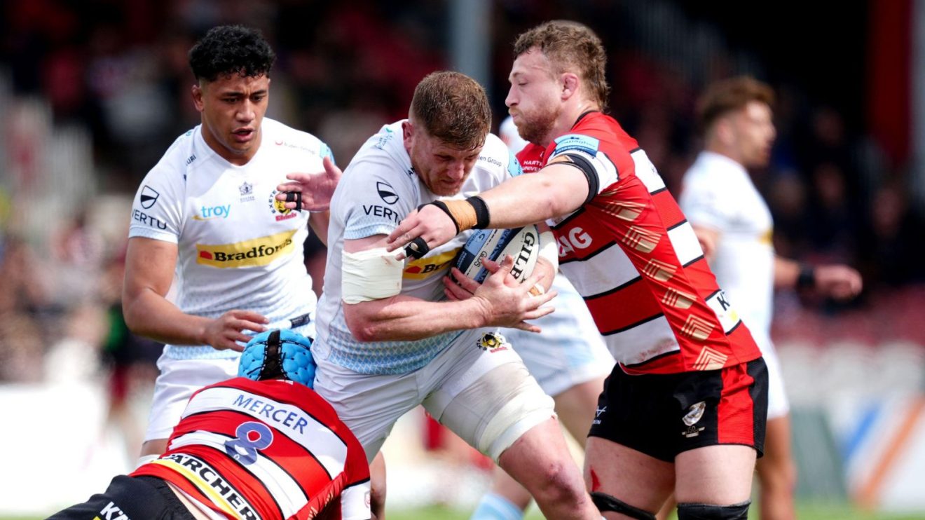Exeter Chief's Jacques Vermeulen (centre) is tackled by Gloucester's Zach Mercer (left) and Ruan Ackermann