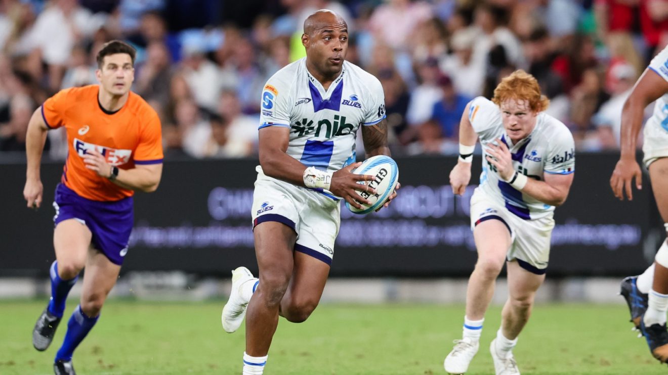 Mark Tele'a on the charge for the Blues.