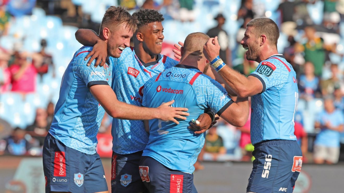 Bulls players celebrate a try.