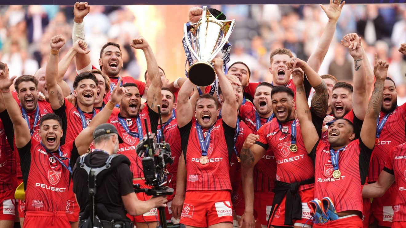 Stade Toulousain players lift the trophy following the Investec Champions Cup final at the Tottenham Hotspur Stadium, London.