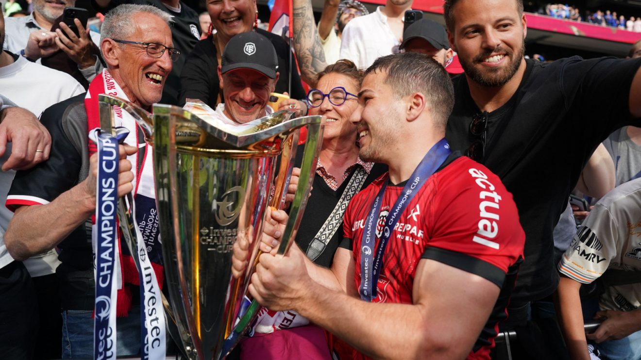 Toulouse scrum-half Antoine Dupont celebrates Champions Cup win.