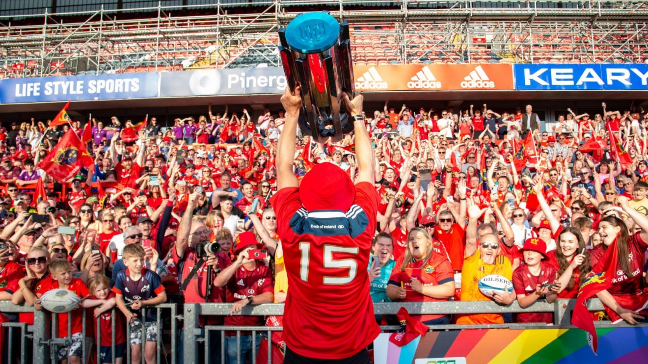 Munster player lifts United Rugby Championship trophy.