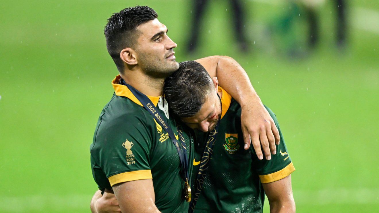 Damian de Allende hugging teary Handre Pollard after 2023 Rugby World Cup final win.