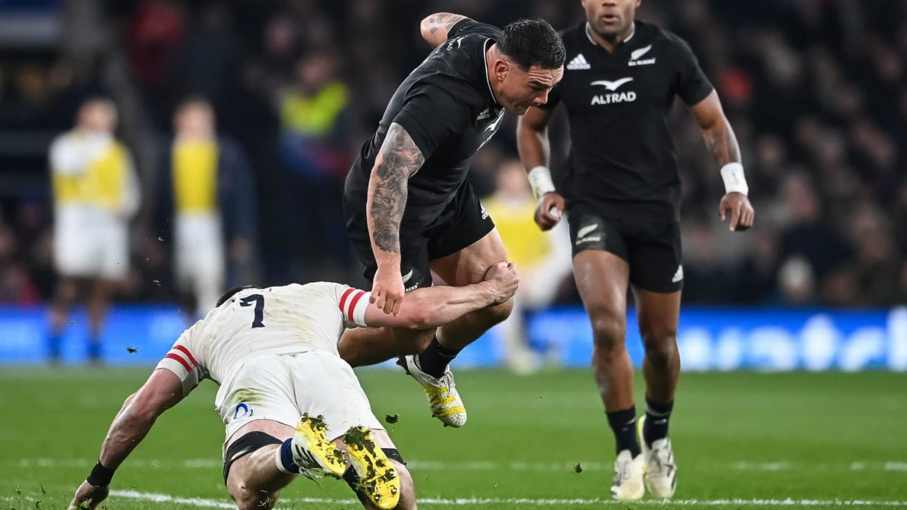 Tom Curry tackling Codie Taylor during England versus All Blacks clash in 2022.