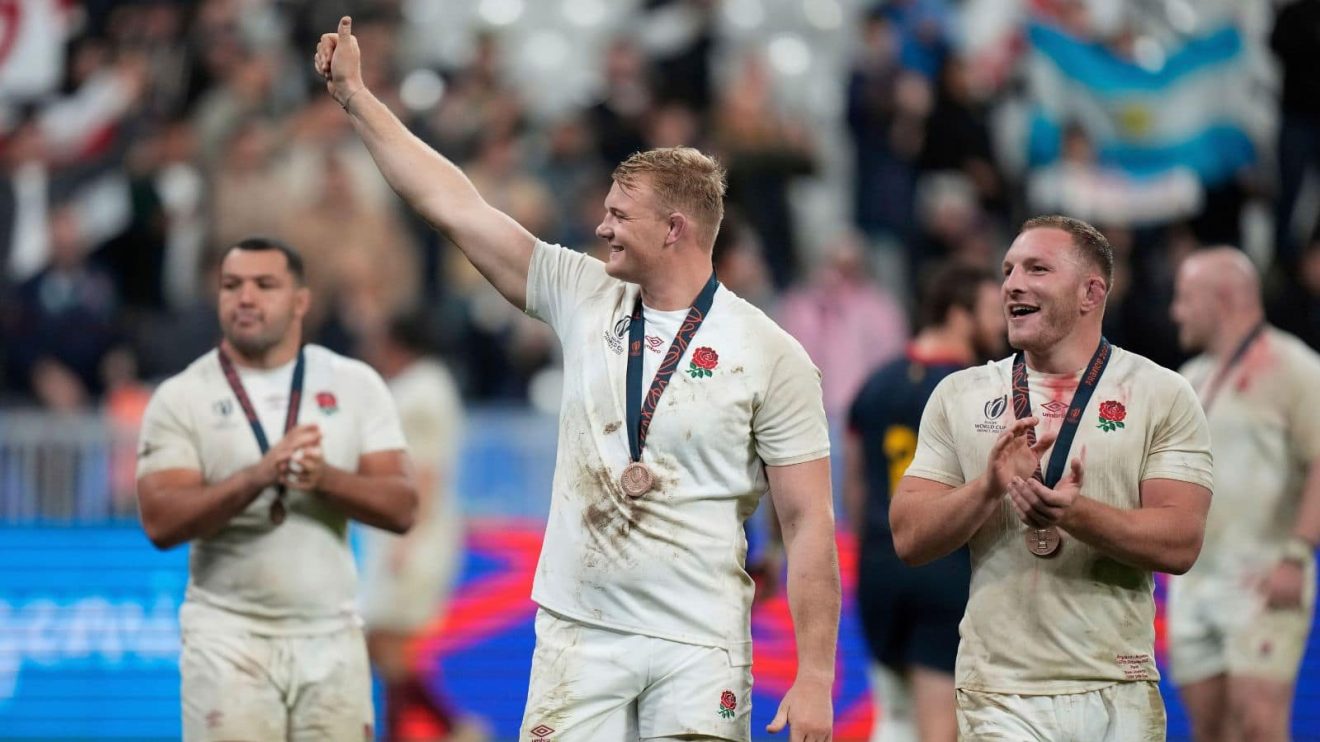England's David Ribbans, center, and England's Sam Underhill, right, react at the end of the Rugby World Cup third place match
