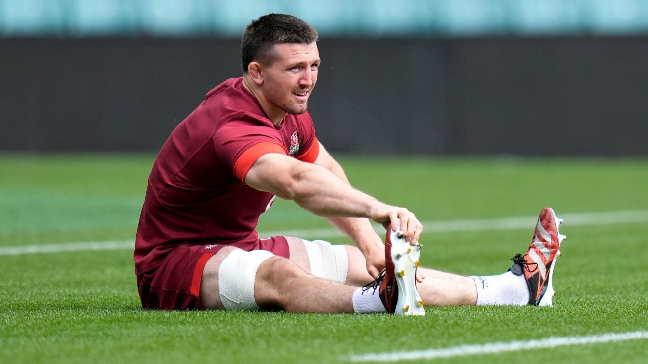 Tom Curry stretching at England training.