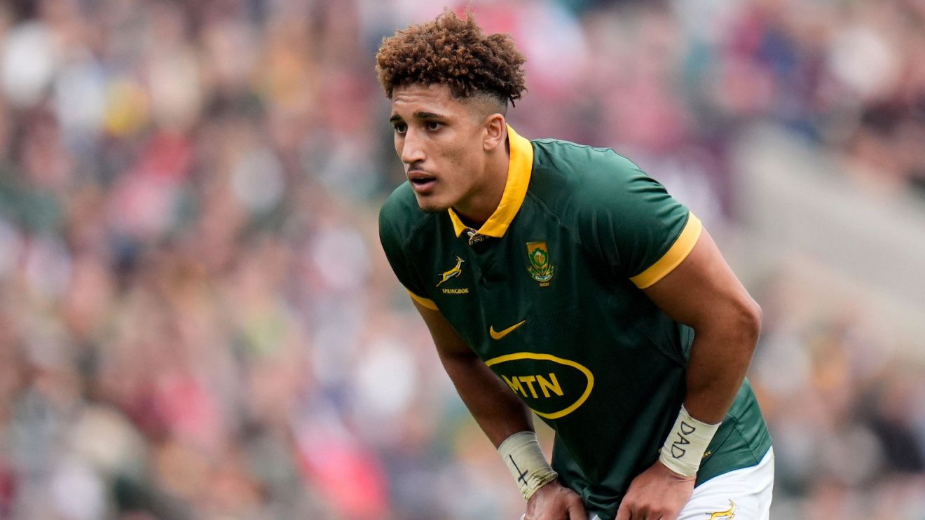 Springboks fly-half Jordan Hendrikse looks on.