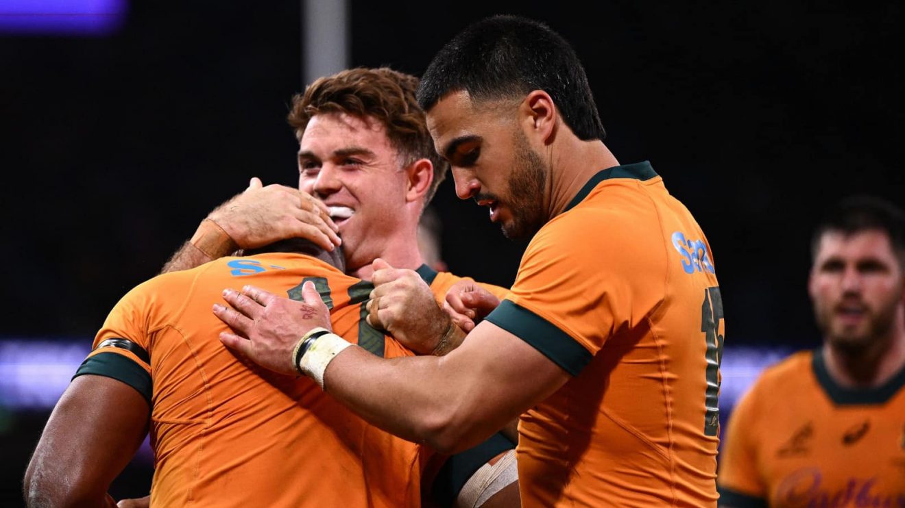 Wallabies celebrate try against Wales during first Test of 2024 series.