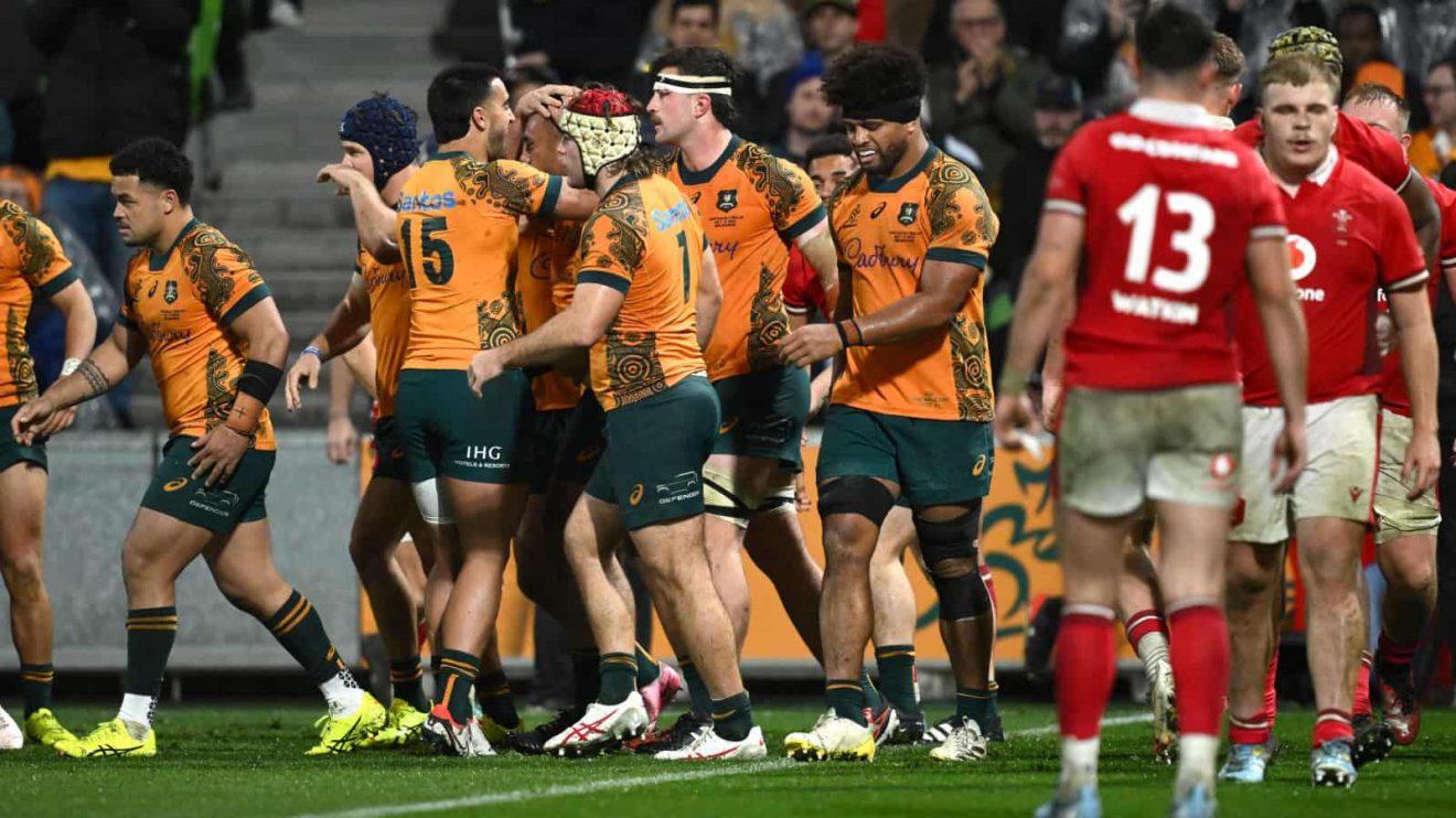 Wallabies celebrate as Wales look dejected in 2024 Test.