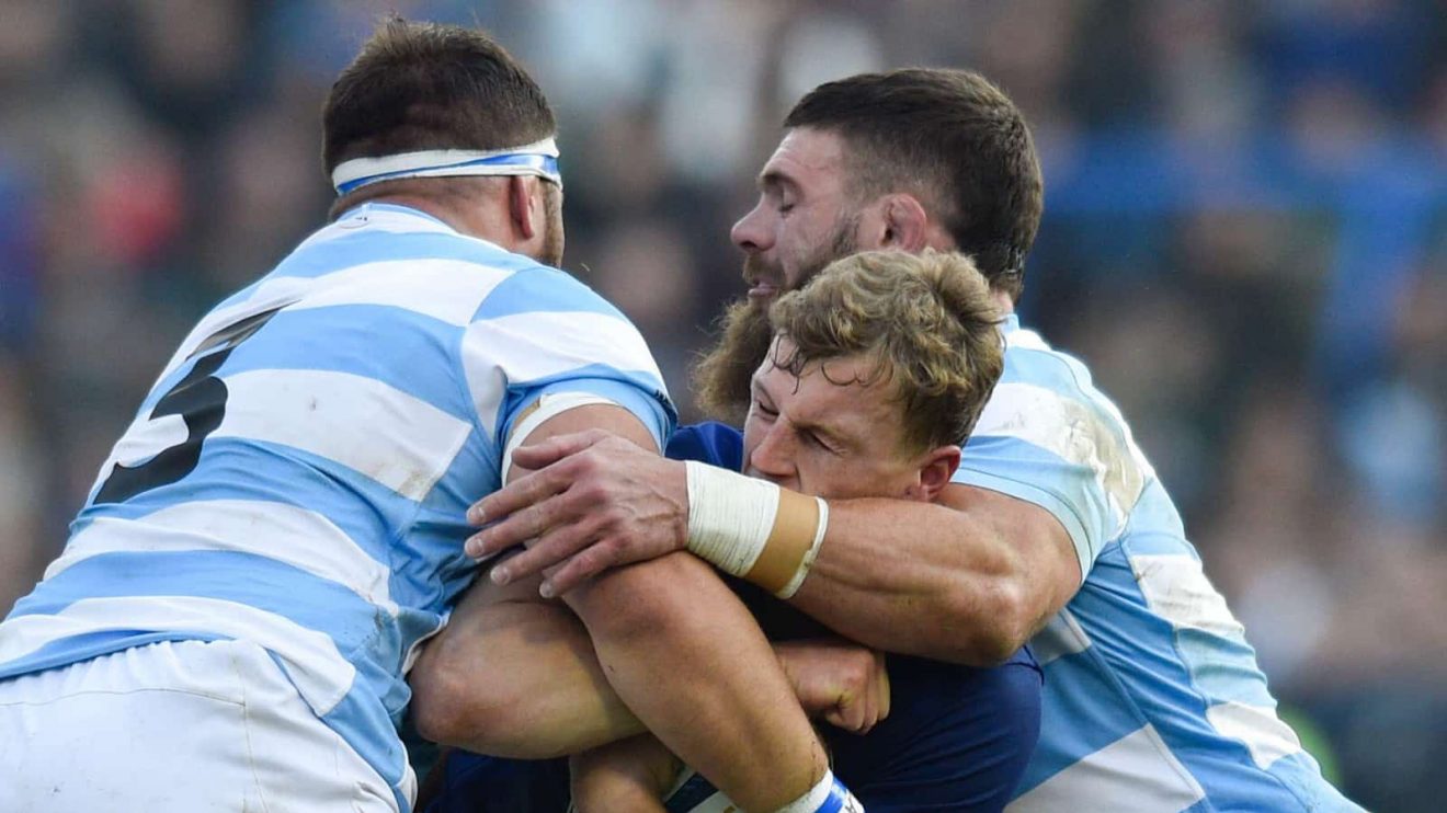 France's Émilien Gailleton is tackled by Argentina's Los Pumas Marcos Kremer, right, and Eduardo Bello