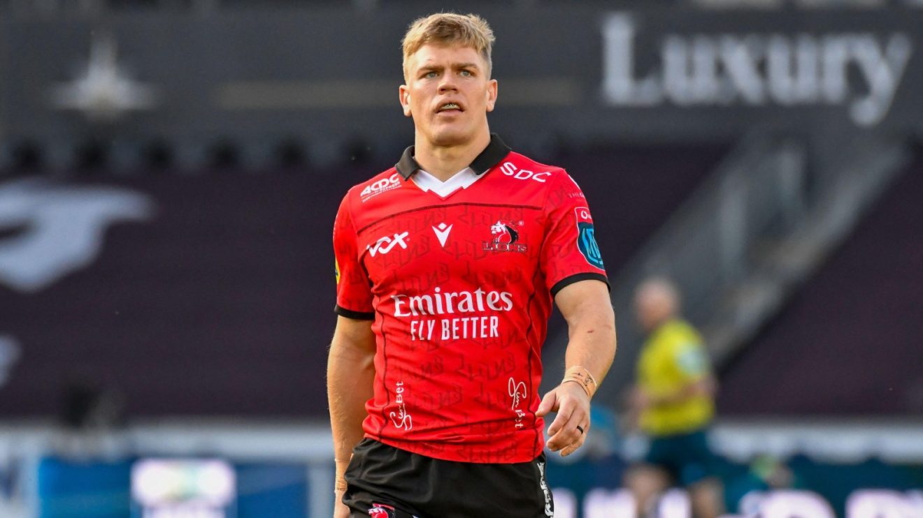 Lions star Morne van den Berg looks on.