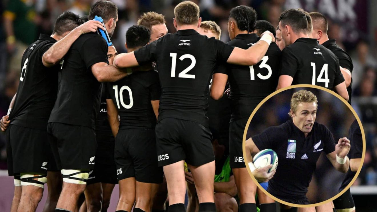 All Blacks team in a huddle alongside former scrum-half Justin Marshall.