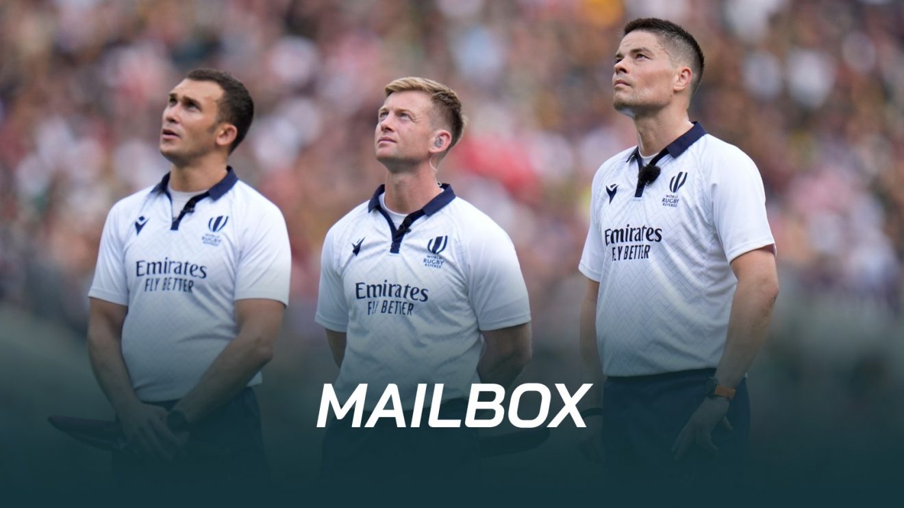 Referees look on during a TMO decision.