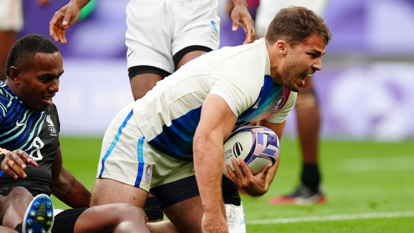 Antoine Dupont scoring a try in the 2024 Olympic final for France against Fiji.